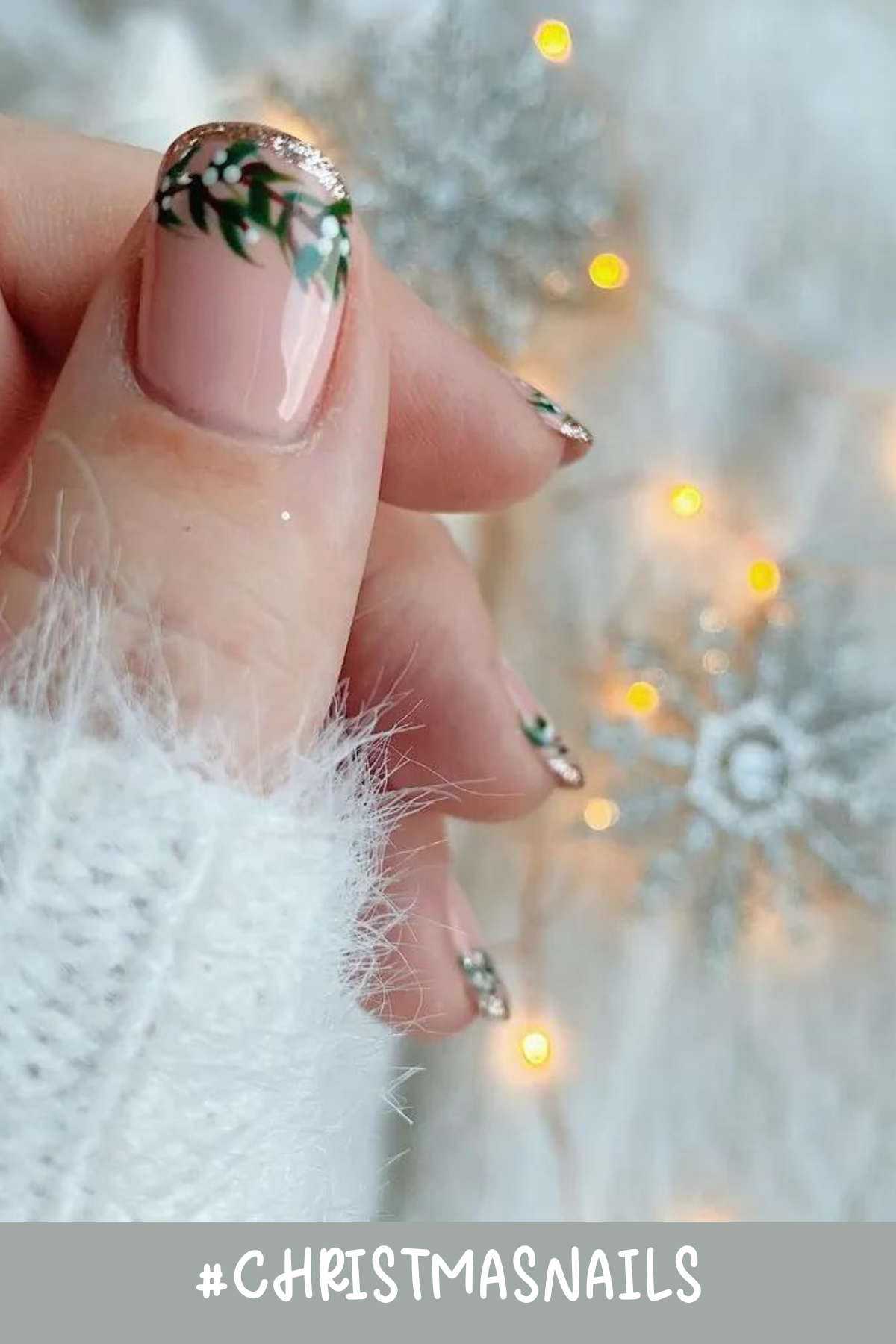 For a more subtle holiday look, these nails bring in a soft, natural base with sprigs of holly and a hint of golden glitter. It’s cozy, cute, and perfect for those chilly nights by the fireplace. This is such a cute twist on French tips and would be great for a Christmas engagement announcement...