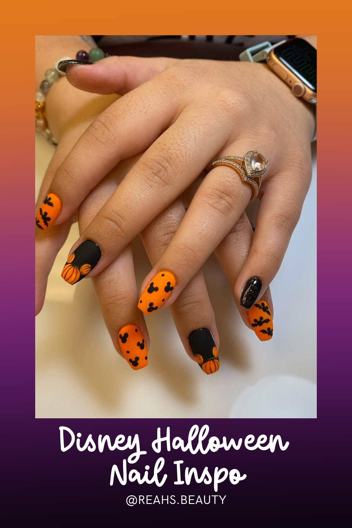 These bold matte black and orange nails with Mickey pumpkins and bat accents are simple but pack a punch—perfect for a Halloween night out at the parks!