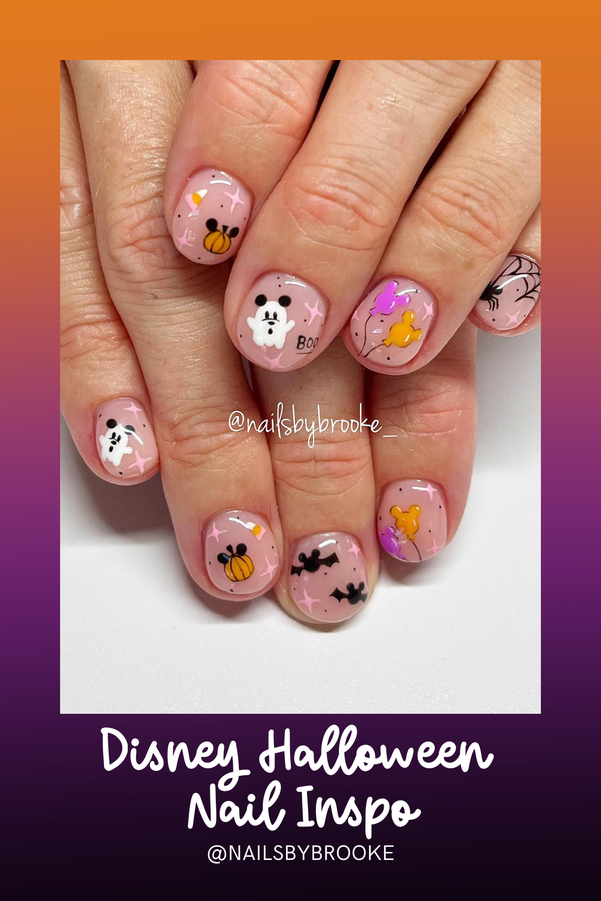 These adorable nails feature tiny ghosts, pumpkins, and Mickey balloons, all accented with soft pink sparkles for a perfectly cute and spooky look—ideal for anyone wanting a subtle Halloween vibe!