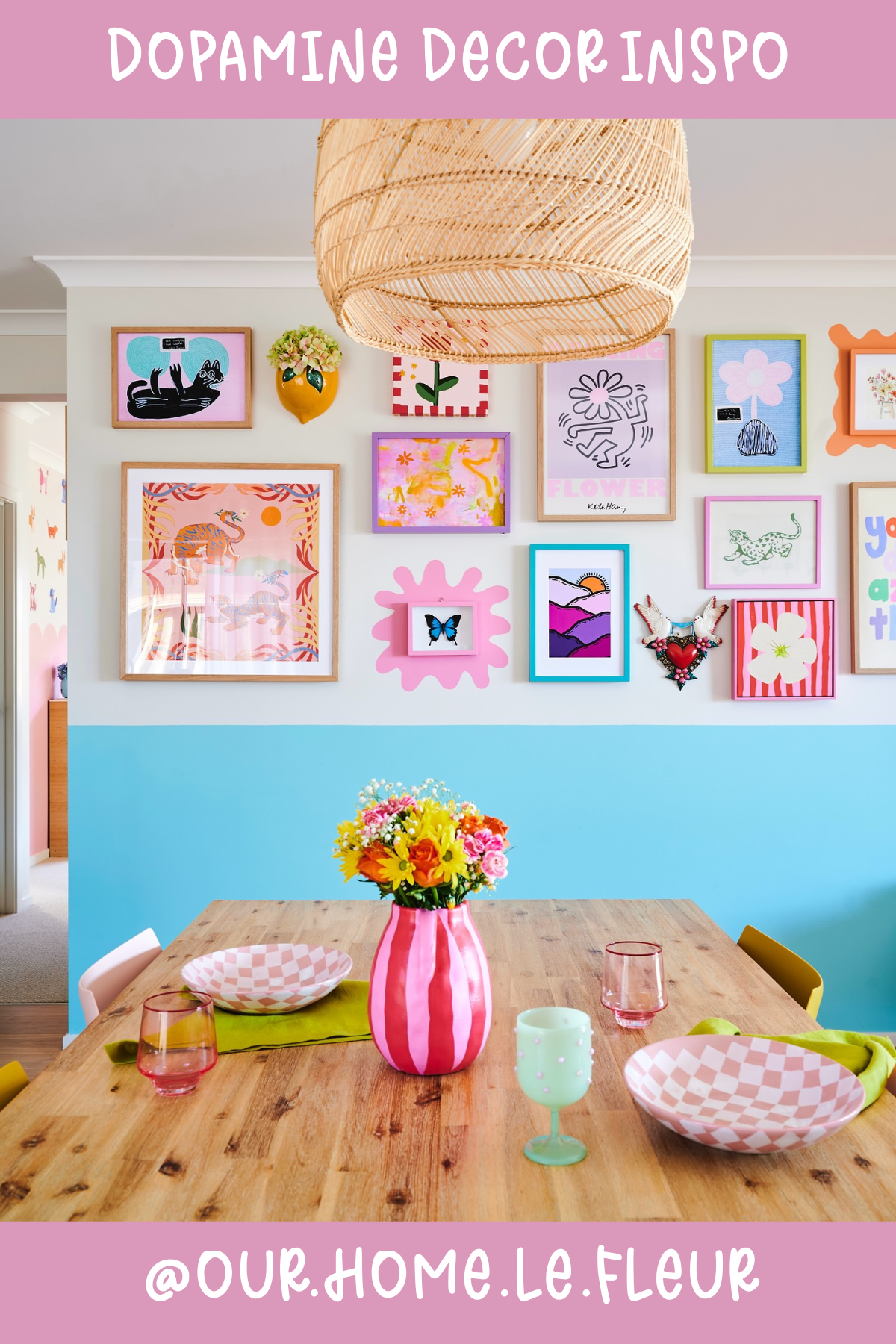 @OUR.HOME.LE.FLEURIt’s a gallery wall gone wild! 🎨 This dining area is a riot of colors with its curated mix of framed art. Paired with a pink striped vase filled with fresh blooms, it’s a playful, vibrant space perfect for conversations and laughter over meals.