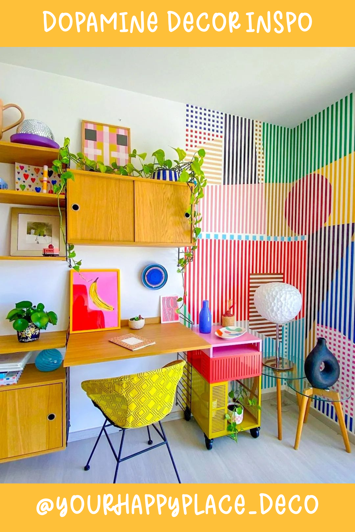 @YOURHAPPYPLACE_DECOThis workspace is a dopamine dream! 🎨 The graphic striped wall, colorful prints, and mix of bold accents give it a playful, artsy feel. The bright yellow chair and pops of greenery add a touch of freshness, creating a space where creativity can run wild.