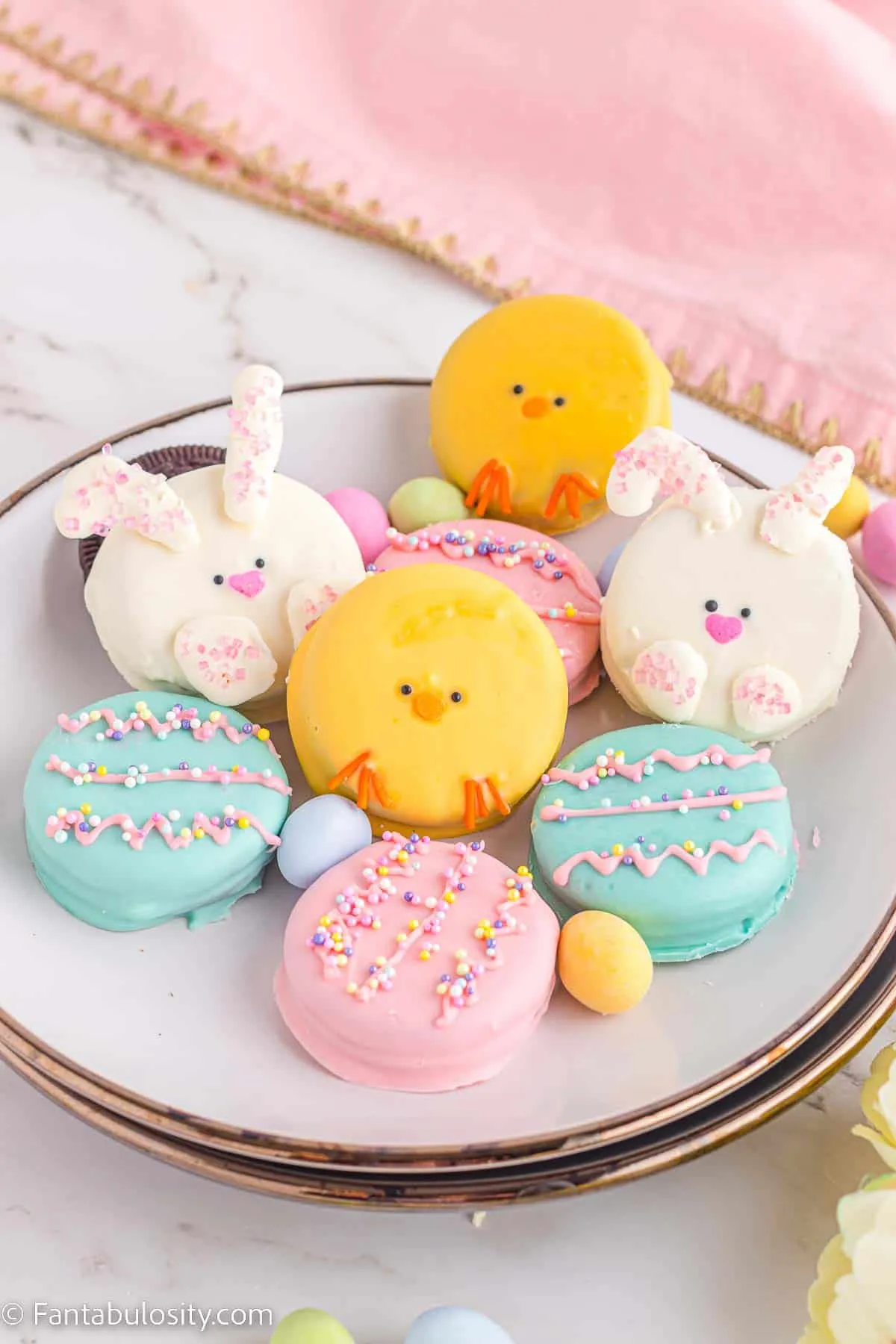 Elevate simple Oreos into stunning Easter treats with this easy recipe. These colorful and chocolate-dipped cookies are perfect for kids and guaranteed to sell out fast!