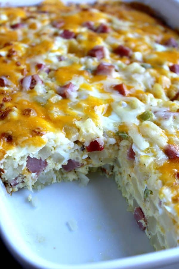This Easy Cheesy Breakfast Casserole is just what you need to feed a crowd for the Holidays - especially as you can make it ahead of time!