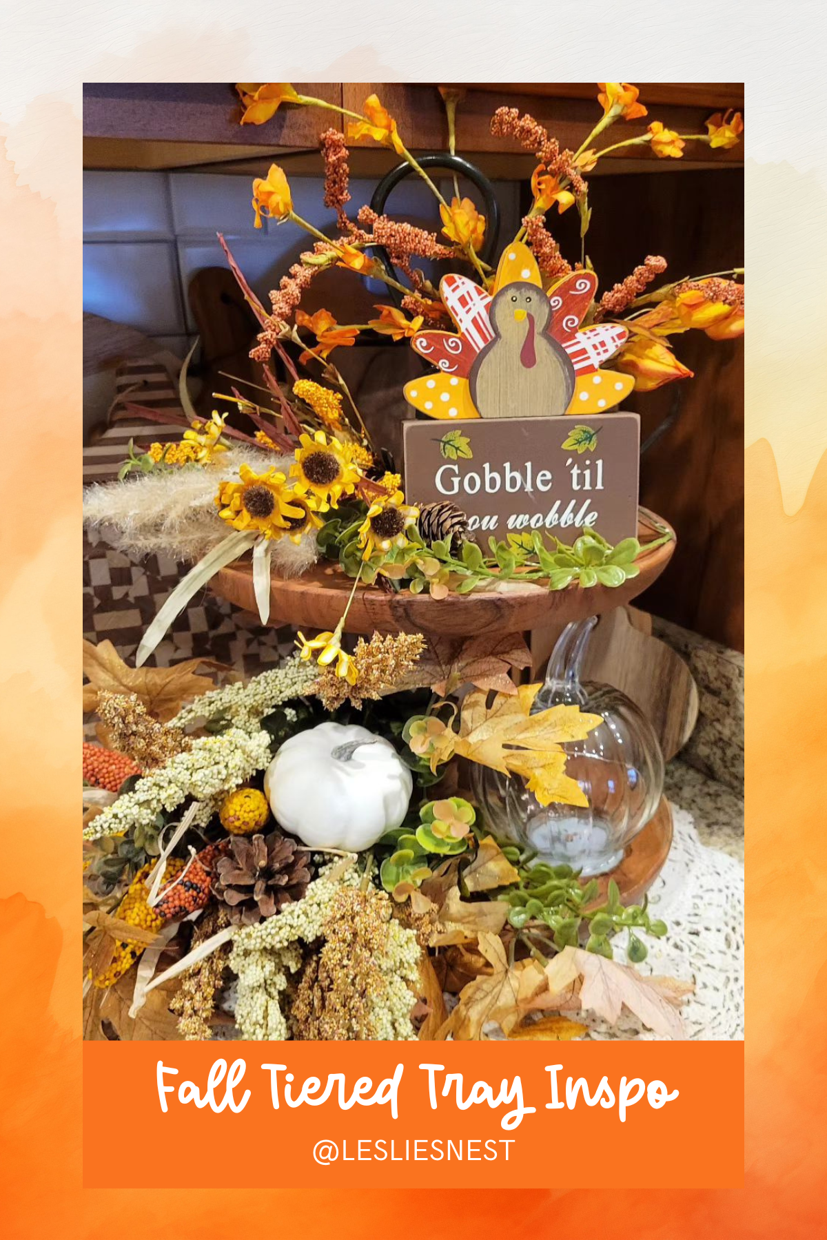 Nothing says Thanksgiving quite like this cheerful turkey tray! Packed with sunflowers, rustic foliage, and a “gobble ‘til you wobble” sign, it’s perfect for a feast-ready home.