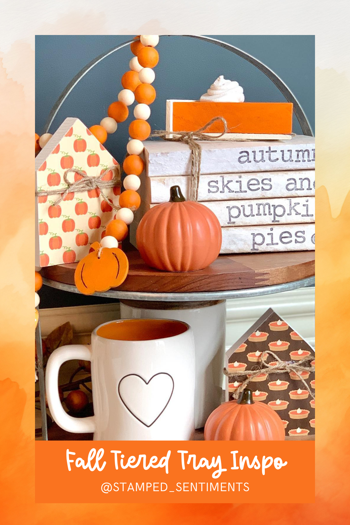 A cheery and fun nod to fall, this tiered tray celebrates pumpkin everything! From adorable mini pumpkins to a stack of books celebrating "autumn skies and pumpkin pies," it's the perfect touch for a cozy corner.