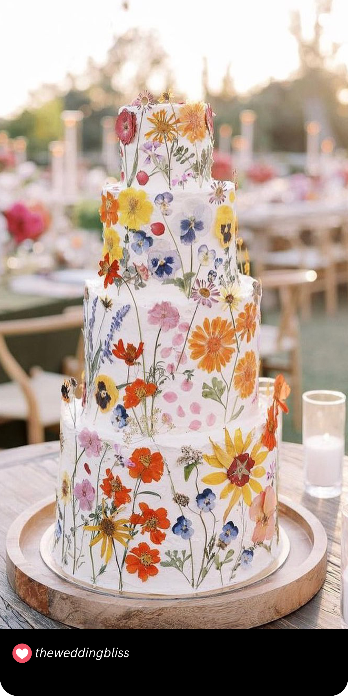 Vibrant Fall Garden: This lively cake bursts with the colors of autumn, showcasing a gorgeous array of hand-painted flowers that bring the fall garden to your wedding table.