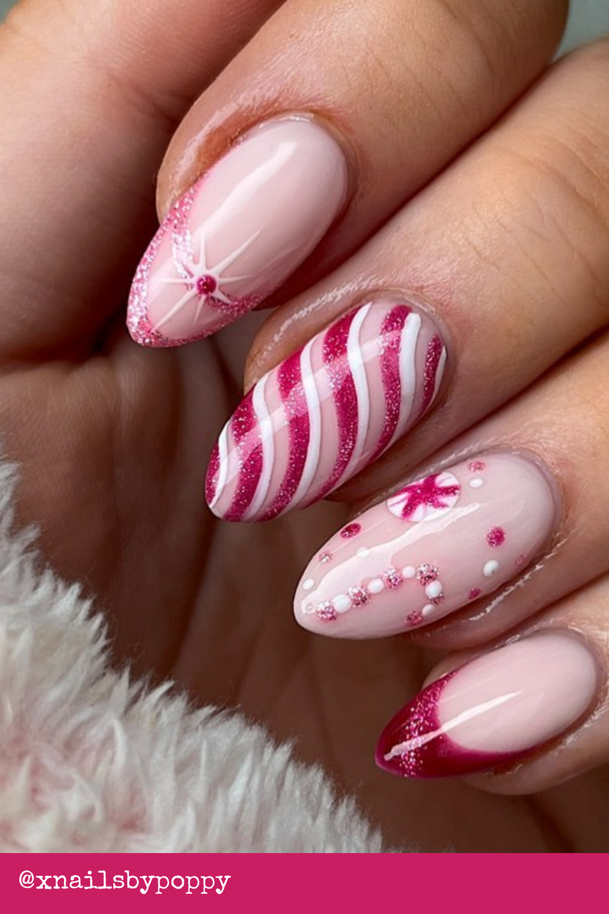 Pink Candy Swirls and Sparkles: Playful pink candy stripes meet glittery French tips, creating a fresh take on Cool Christmas Nails. Perfect for anyone who loves a pop of color during the holidays.