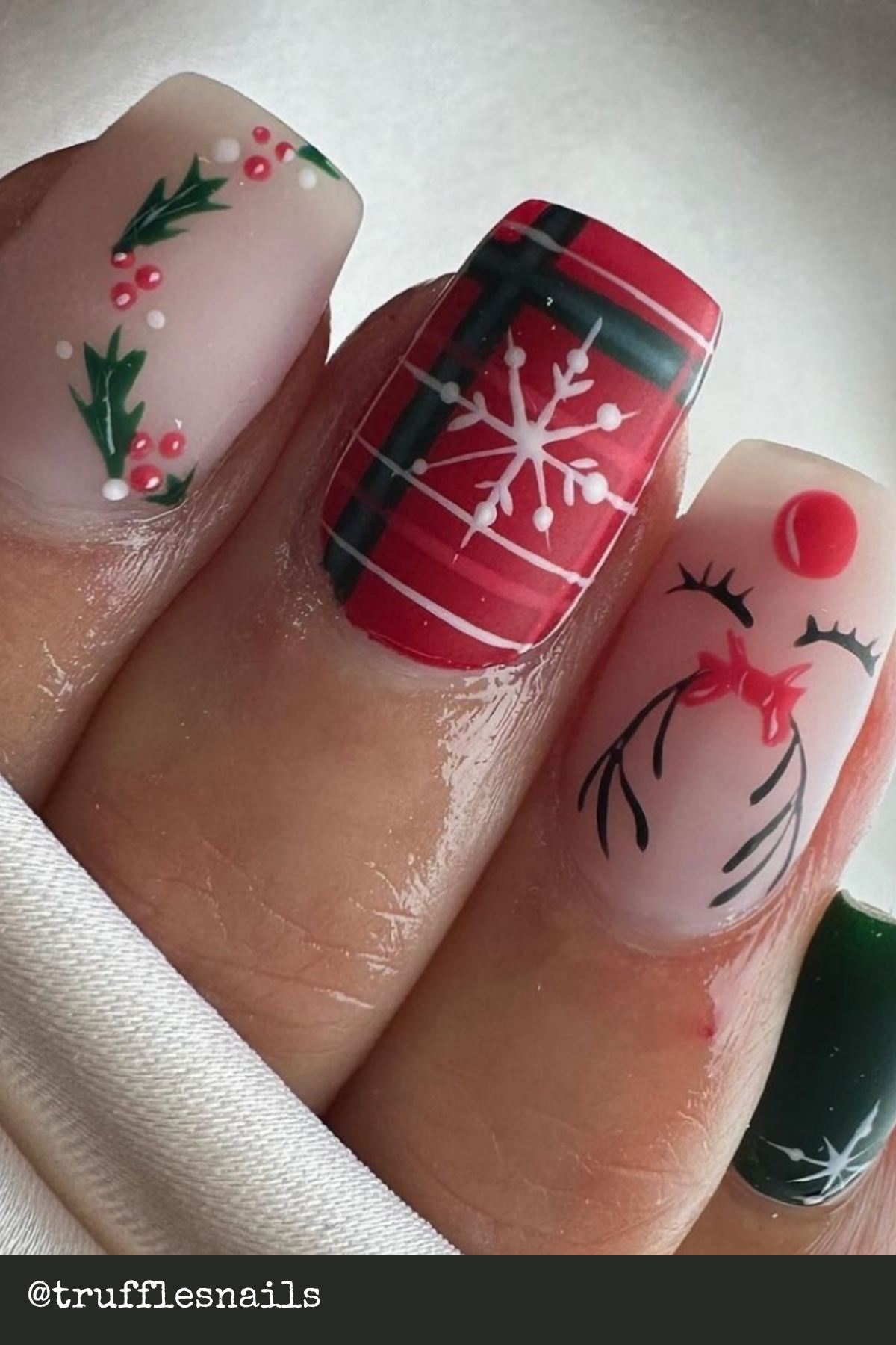 Classic Plaid with Reindeer Silhouettes: Plaid and reindeer make an elegant pairing that screams Trending Christmas Nails. Ideal for both casual parties and dressier events!