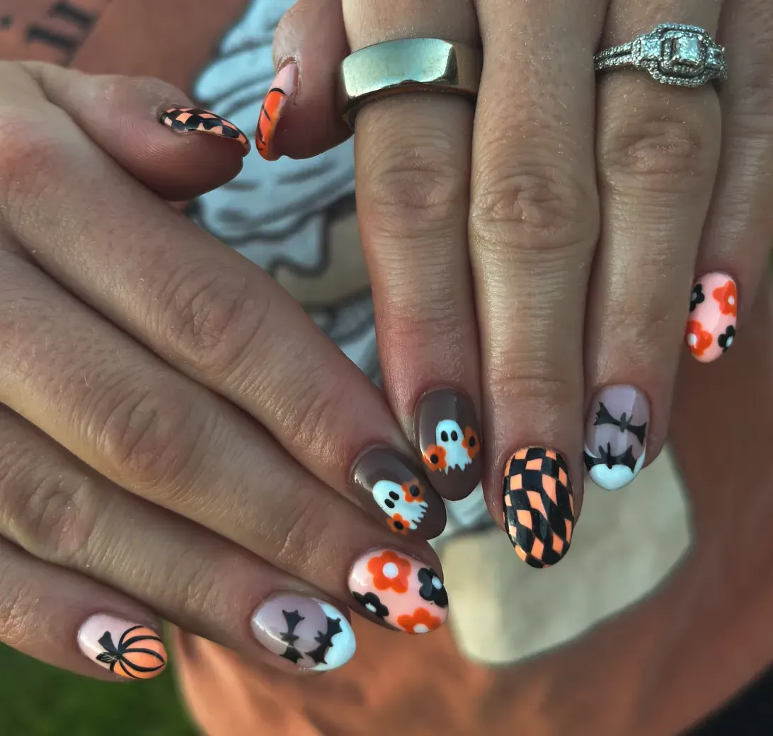 10. Retro Halloween Mix 🧡🖤If you’re into nail art that tells a whole story, this set is for you. You’ve got checkerboard patterns, mini pumpkins, flower-power vibes, bats, and of course—the sweetest little ghosts. It’s bright, retro, and totally October-approved, perfect for those who can’t choose just one Halloween theme.