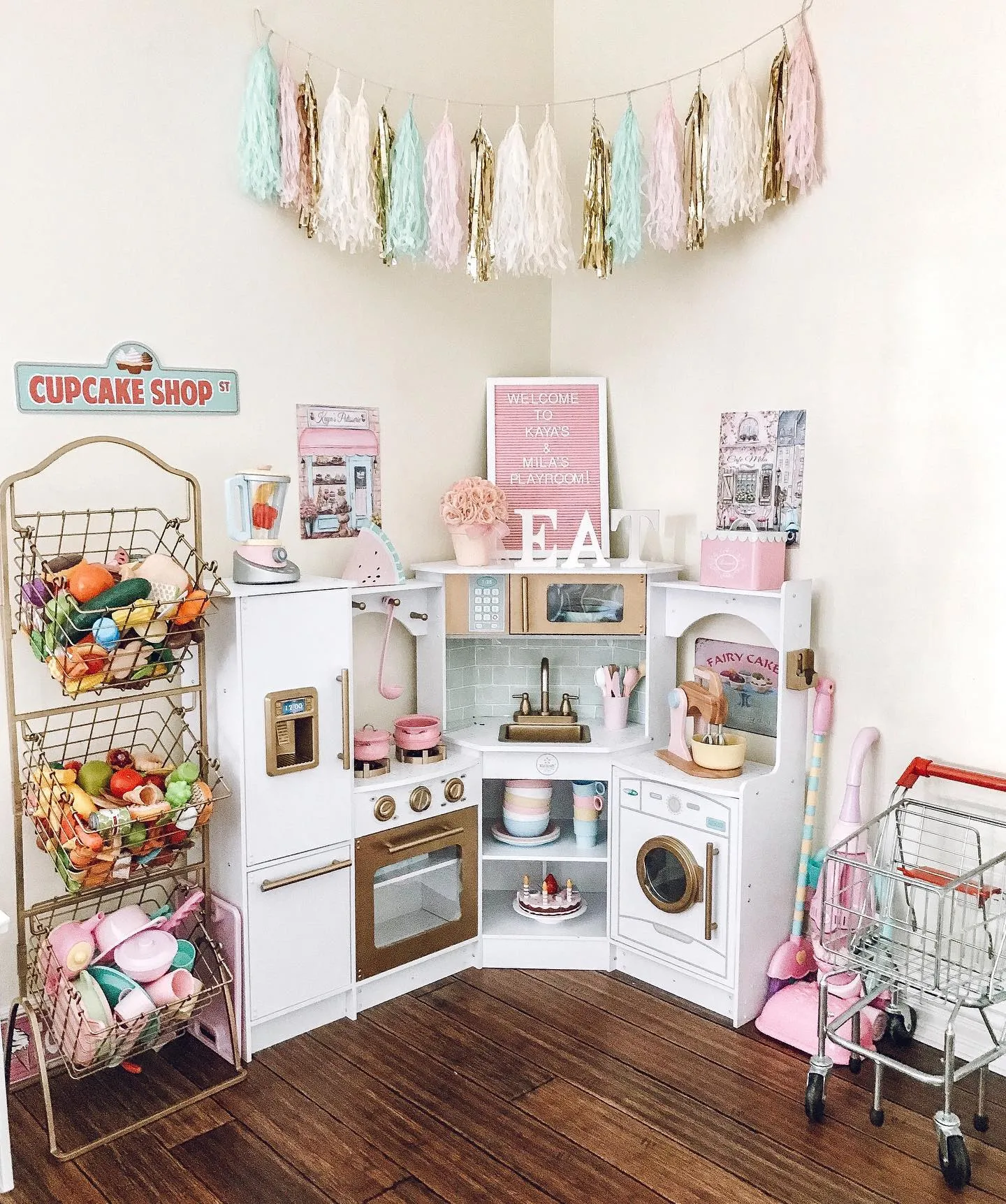 Mini Kitchen Magic – A charming play kitchen setup complete with pastel accessories, a market stand, and cute storage baskets—perfect for little chefs in the making.