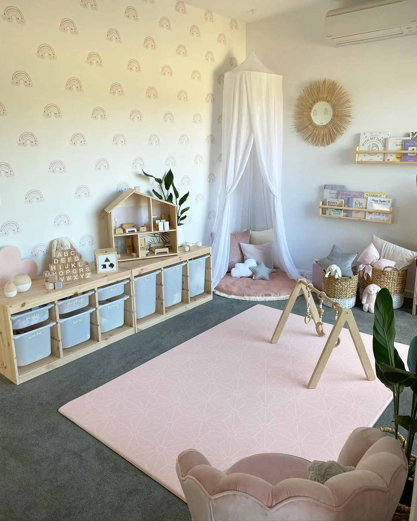 Minimal & Modern Play Space – A calming, neutral-toned playroom featuring a reading nook with a dreamy canopy, wooden storage, and soft textures for a cozy feel.