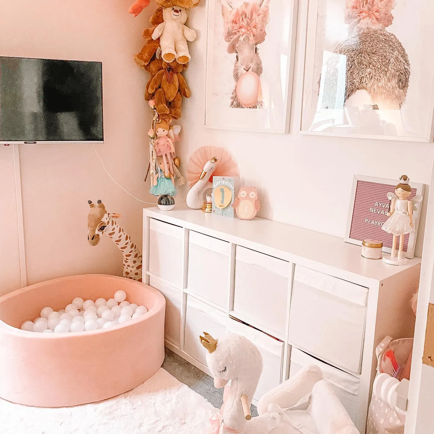 Blush-Toned Ball Pit Fun – A soft pink ball pit, adorable plush toys, and cozy storage make this playroom a perfect mix of fun and relaxation.