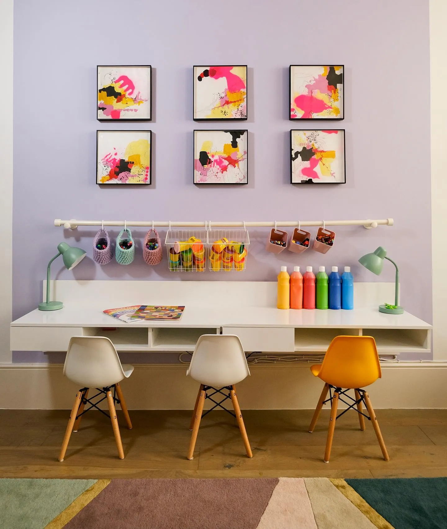 Creative Art Station – A modern craft space with a floating desk, colorful artwork, and hanging storage to keep all the little artist’s supplies within easy reach.