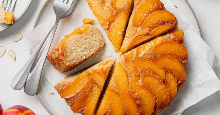 Gluten-free Peach Upside Down Cake is the perfect summer cake. Caramelized peaches end up on top of a buttery almond flour cake that is light and tender. This easy to make cake is perfect for a summer cookout or potluck.