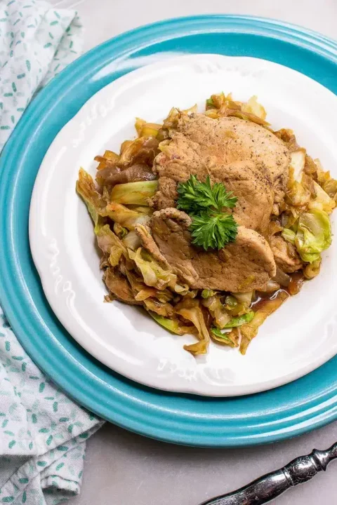 Savor the hearty flavors of our Savory Pork and Cabbage Skillet! Tender pork, fresh cabbage, and a blend of spices come together in this quick and delicious one-pan meal. Perfect for busy weeknights or a comforting dinner. ? #OnePanMeal #PorkSkillet
