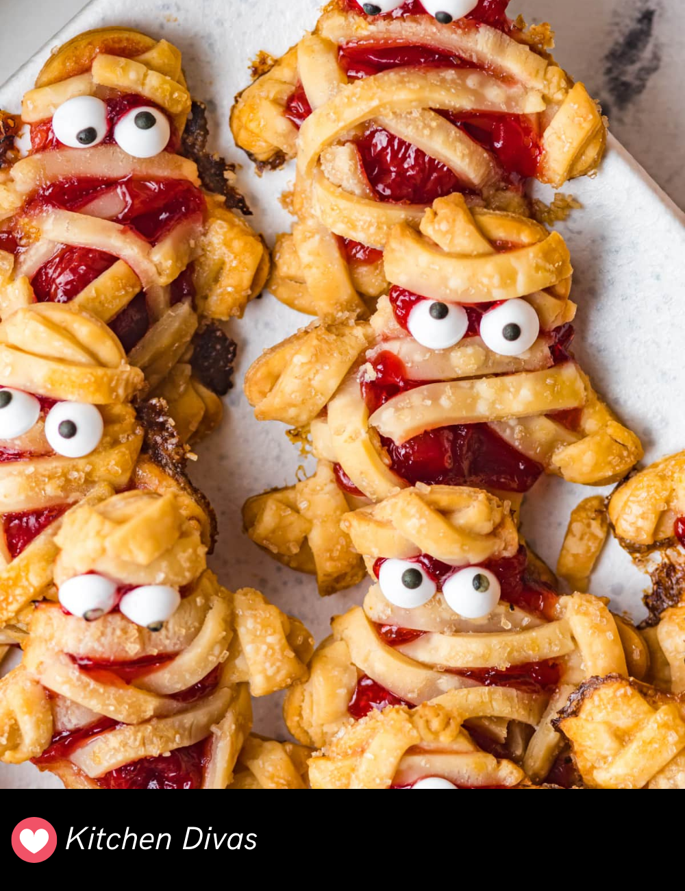 These Mummy Cherry Hand Pies are an eerie-sweet addition to your Halloween party table. Wrapped in a flaky pastry with peeking “eyes,” these hand pies are filled with a luscious cherry filling. They’re easy to grab and enjoy, making them ideal for party appetizers or a spooky dessert.