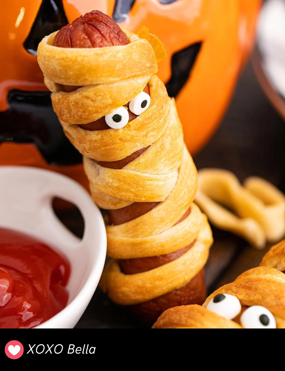 Mummy Halloween Hot Dogs are a must-have for any Halloween party! These classic pigs in a blanket are wrapped in crescent roll “bandages” and have little eyes peeking out. They’re a fun, easy appetizer that’s sure to be a hit with both kids and adults.