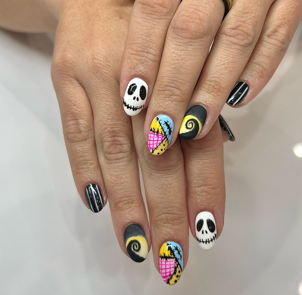 Nightmare Nails – Jack and Sally come to life with this colorful Nightmare Before Christmas inspired design.