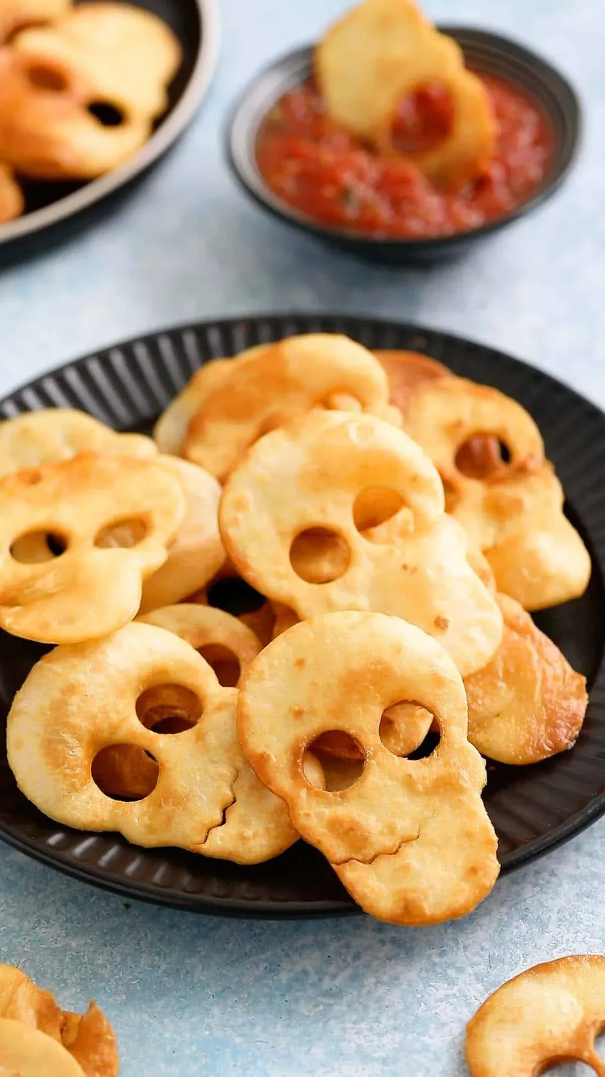 These crispy baked skull chips are spooky, salty, and perfect for dipping into a bloody-good salsaâgreat for a party snack board or classroom party!