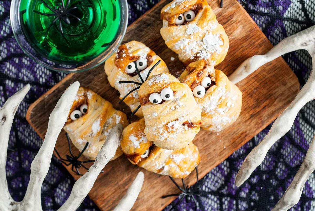 Candy gets a creepy twist with these Snickers bars wrapped in flaky dough and topped with candy eyesâan irresistible mix of sweet, salty, and spooky.