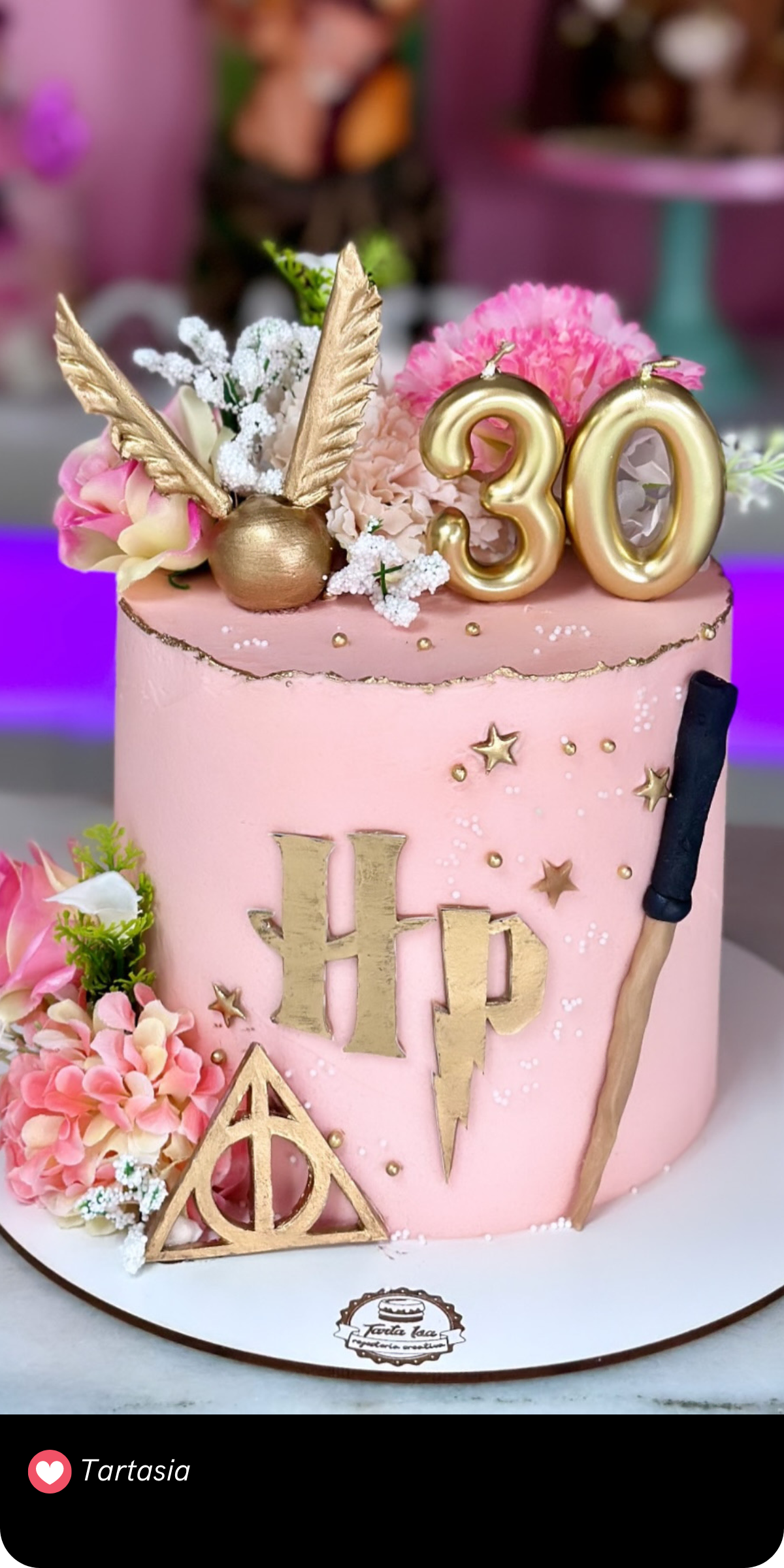 This enchanting cake gives a delightful twist to the Harry Potter theme with its soft pink base and elegant golden accents. Adorned with a golden snitch, a wand, the Deathly Hallows symbol, and delicate floral decorations, it strikes a perfect balance between whimsy and sophistication. The addition of the number "30" makes it an ideal choice for a milestone birthday, celebrating the magic of any age!