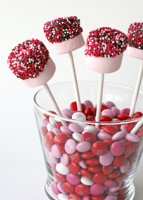 LOVE these! What a wonderful way to present some YUMMY chocolate dipped marshmallows. This treat is simple enough for even a toddler to make for a friend. 