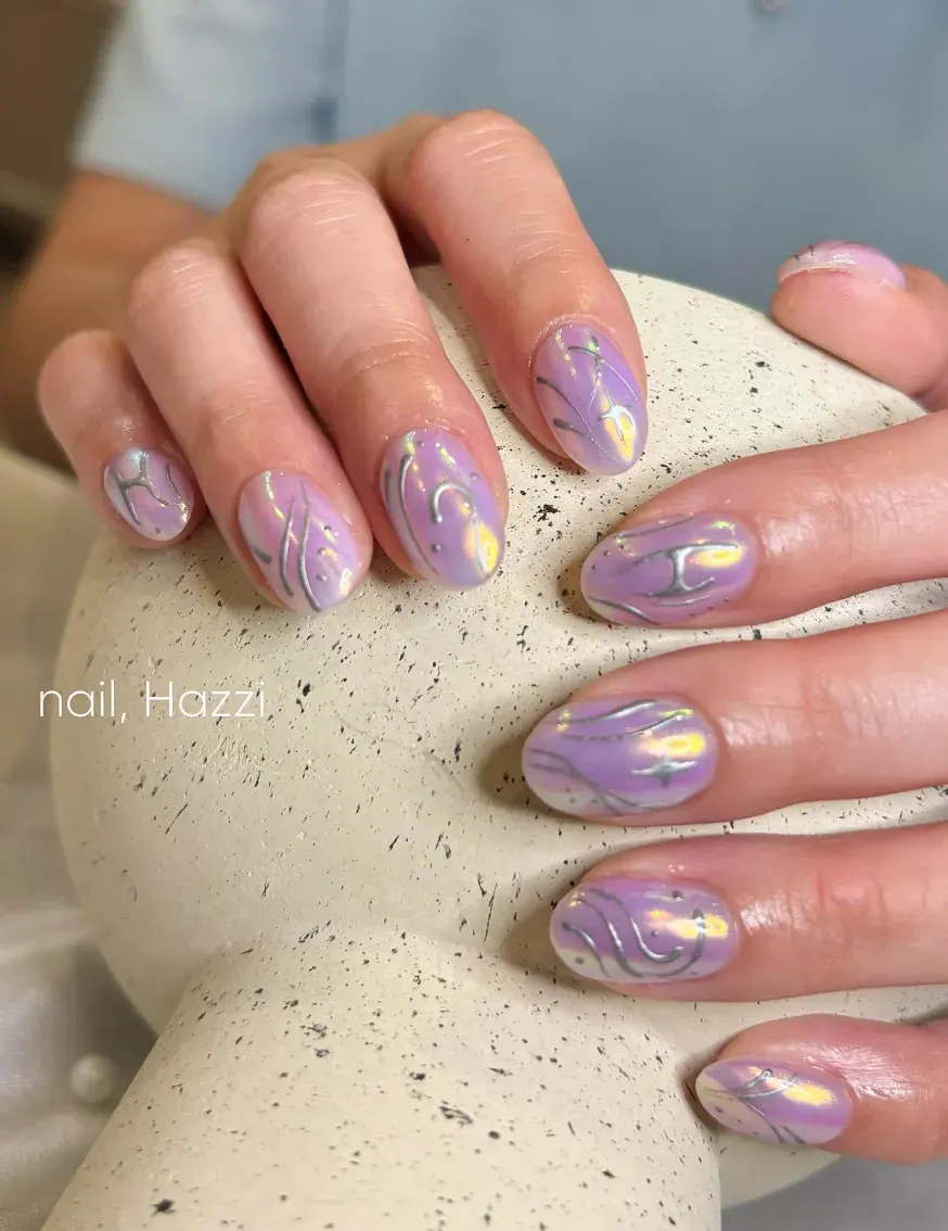 Smooth chrome with lilac undertones and silver swirls — elegant, futuristic, and perfectly in sync with the movie’s K-Pop-meets-magic aesthetic.