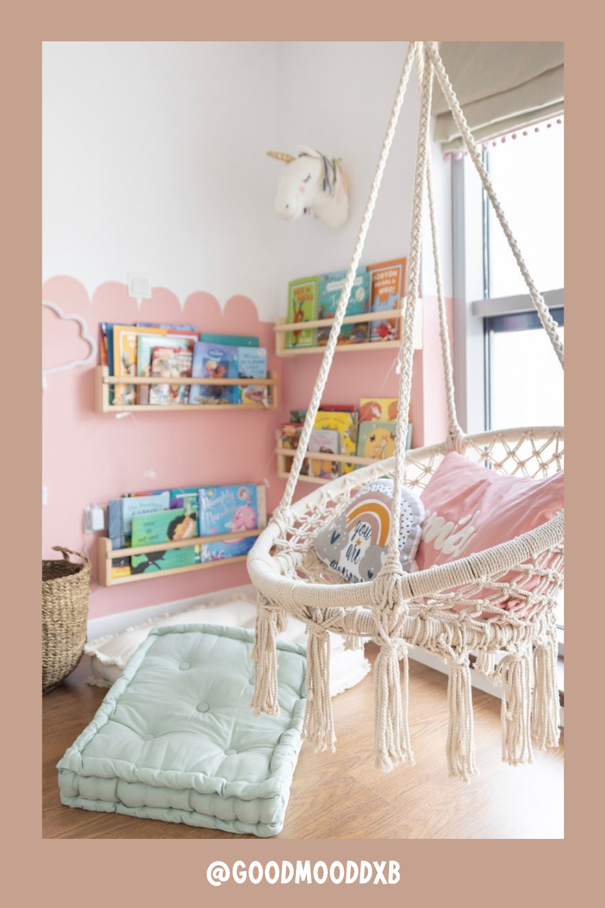 This nook brings a bit of magic into the room with its charming hanging chair! The pink scalloped wall, unicorn head decor, and rainbow accents add a dreamy feel. With a basket full of books, a stack of floor cushions, and cozy pillows inside the swinging seat, it’s the ultimate space for children to get lost in their favorite fairy tales.