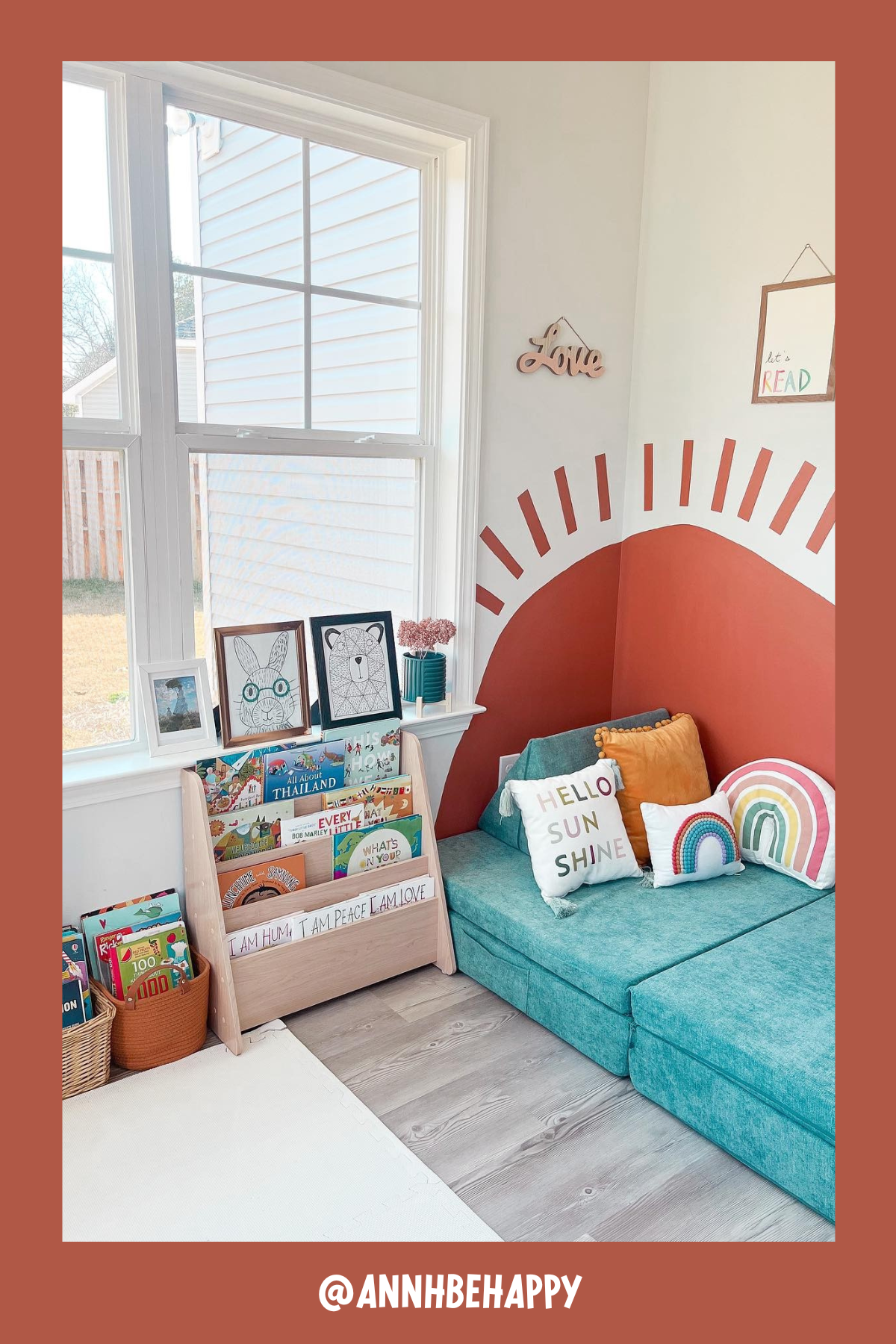 Bright and cheerful, this nook is bathed in natural light, thanks to the large window beside it. The teal couch cushions and sunny pillows add a burst of color, while the mini bookshelf neatly holds a selection of picture books. It’s a comfy, sunlit spot ideal for afternoon reading sessions.