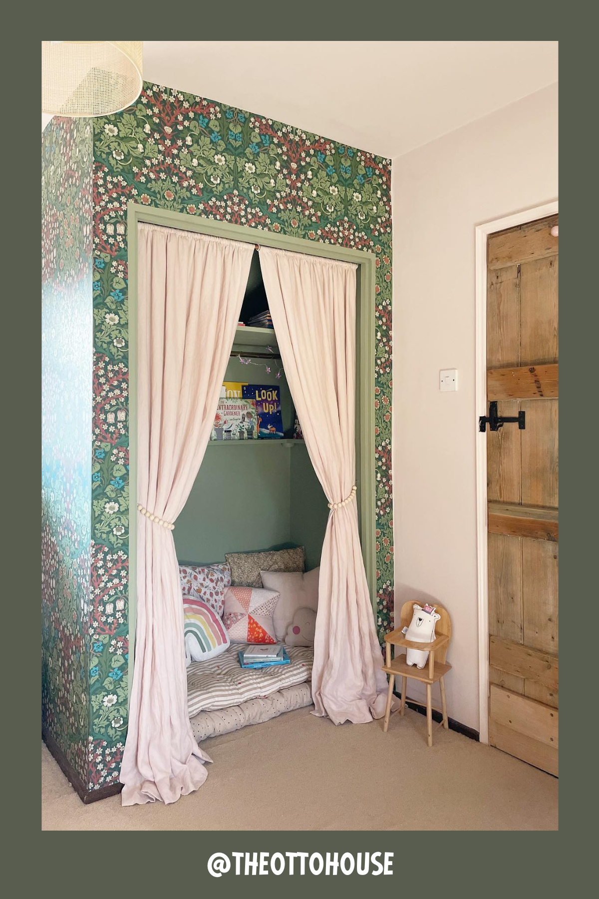 This hidden reading nook is a dreamy retreat with its floral wallpaper and soft, blush-colored curtains. Step inside, and you’ll find a cushiony floor space sprinkled with patterned pillows, creating a comfy cocoon for young readers. The mini shelf in the corner is stocked with books, adding both function and a touch of whimsy. It’s like a secret storybook haven!