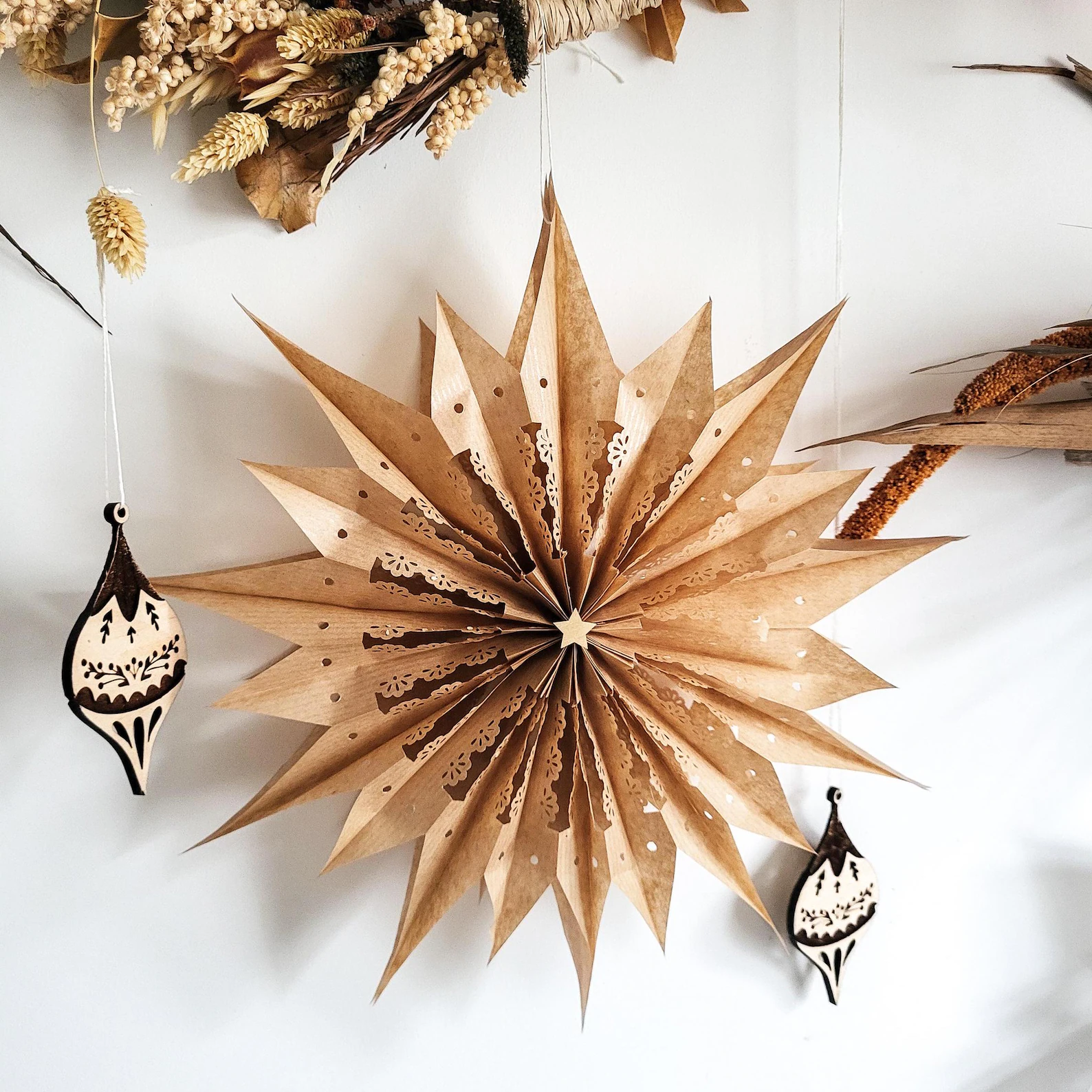 This handcrafted paper star is the perfect mix of simplicity and wow-factor. With its earthy tone and delicate cutout details, it brings that cozy boho charm to your Christmas decor — no glitter needed. Hang it on your wall, in a window, or above your tree for a soft, natural statement that feels timeless and handmade. It folds flat for easy storage too, so you can enjoy its warm glow year after year.
