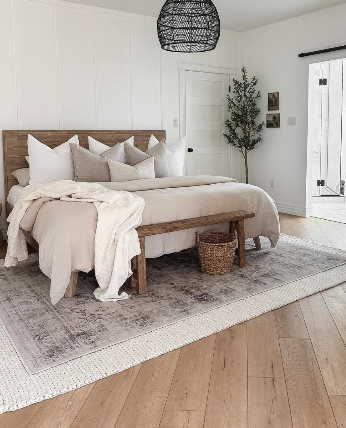 Adding or layering rugs instantly boosts coziness and texture in your bedroom. A new rug can anchor your furniture and define the space, while layering smaller rugs over an existing one creates visual interest and warmth.