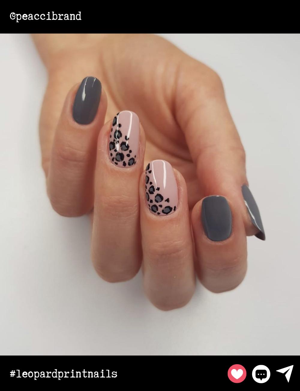 Almond-shaped nails get a modern twist with a soft nude base paired with a chic leopard accent running diagonally. The muted gray polish on some nails adds a sophisticated, neutral balance.