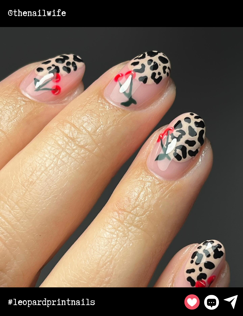 Short almond-shaped nails get a playful twist with leopard print and cherry accents. The combination of minimalist design with fun details keeps things fresh and unique.