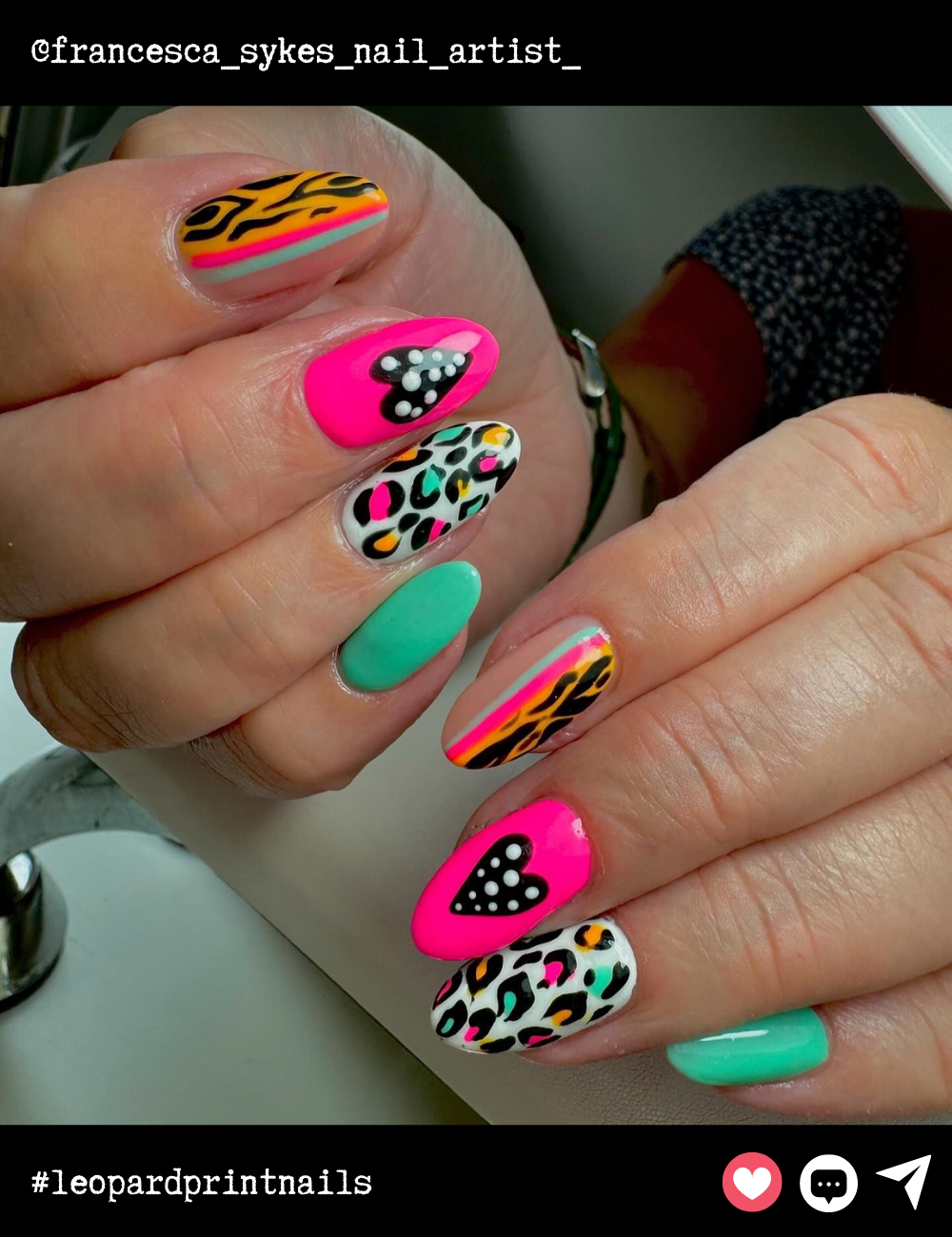 Almond nails go full-on wild with a colorful array of leopard print paired with neon stripes and hearts. This playful mix of patterns and colors is perfect for making a fun, fearless fashion statement.