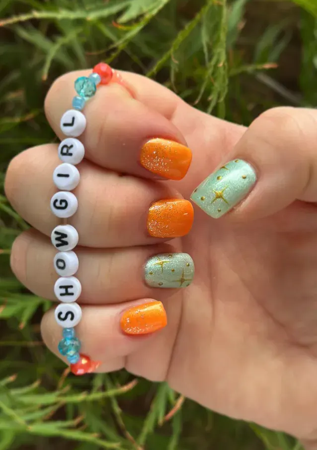 This one pairs perfectly with a DIY friendship bracelet. Teal and orange nails with a sprinkle of sparkle feel personal, playful, and full of Swiftie heart. 🩵🧡 Nail art design inspired by Life of a Showgirl Taylor Swift 🩵🧡