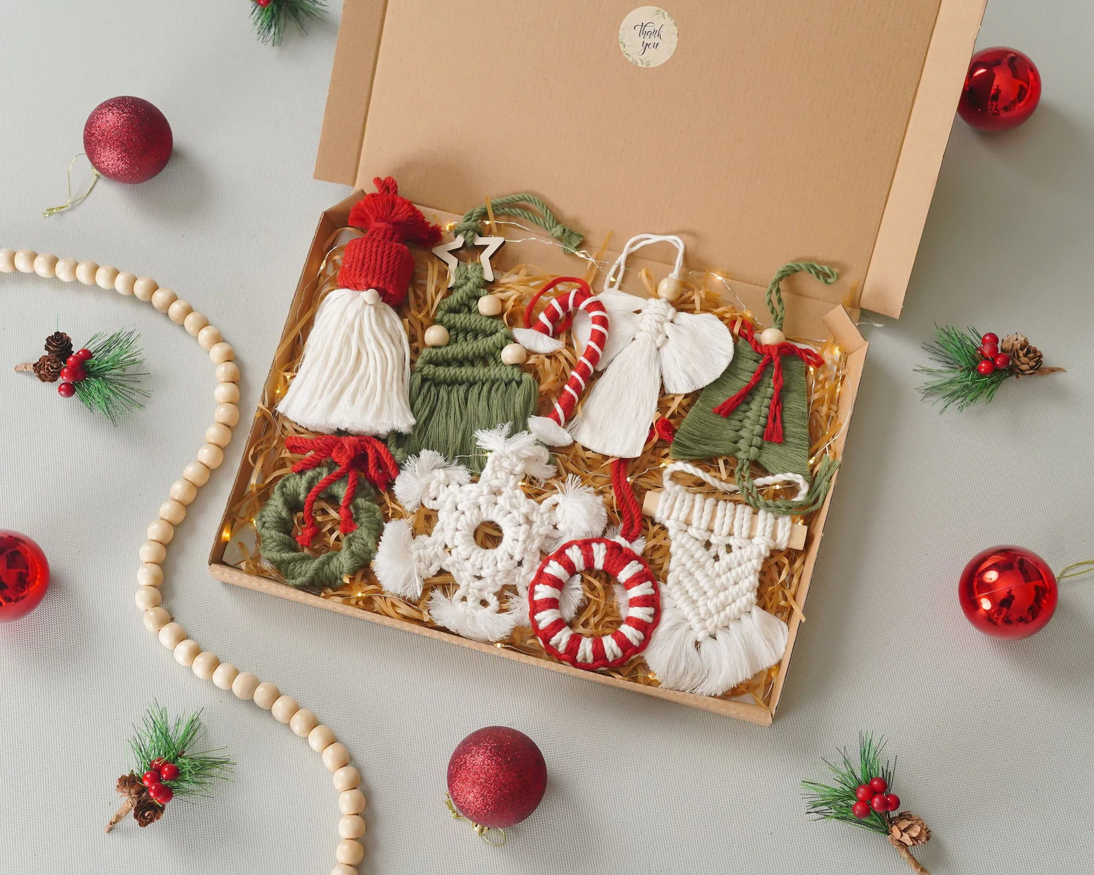 Bring a little boho magic to your holiday decorating with these beautiful macrame ornaments. Each one is handwoven from natural cotton cord, giving your tree that cozy, handmade charm that feels straight out of a winter cabin. The mix of textures and soft neutral tones adds warmth and style — perfect for anyone who loves that modern farmhouse or Scandinavian vibe. Whether you hang them on your tree or tie one to a wrapped gift, these ornaments make your space feel effortlessly chic and oh-so-cozy.