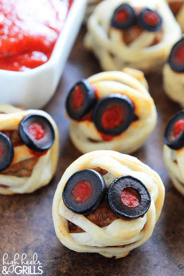 Juicy meatballs wrapped in crescent dough bandages with olive eyesâthese bite-sized mummies are both adorable and totally snackable with marinara on the side!