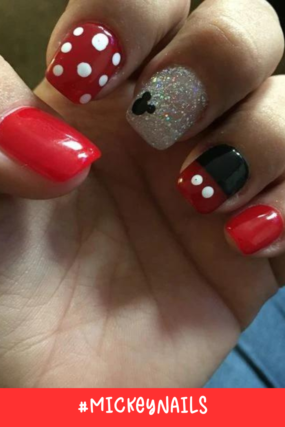 Red, black, and glitter come together in this Mickey-inspired nail design. With classic polka dots and a glittery accent nail featuring a small Mickey silhouette, this set is perfect for short nails with a simple Disney theme.