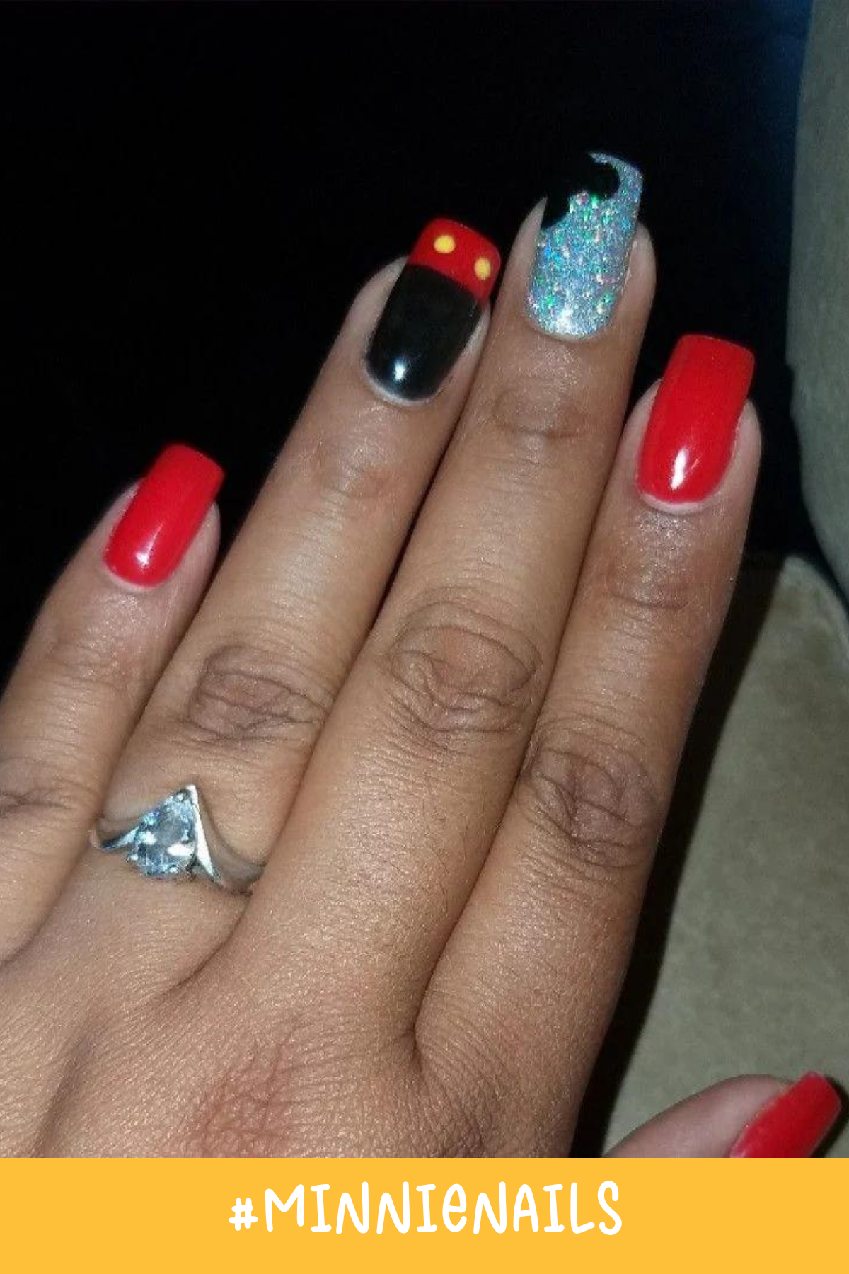 Red and black nails with glitter accents bring this Mickey-inspired nail art to life. A glittery nail with a small Mickey silhouette and a bold Mickey shorts design make these Disney design nails stand out.