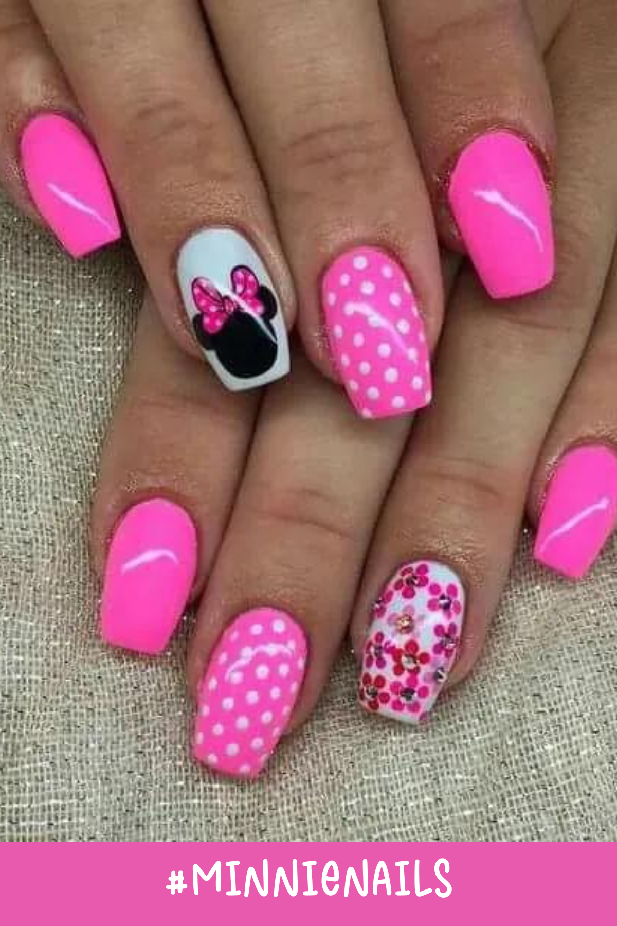 Bright pink nails with polka-dot patterns and a glittery accent nail make this set a standout. A prominent Minnie Mouse silhouette on one nail ties together the fun, vibrant Minnie Mouse nail designs.