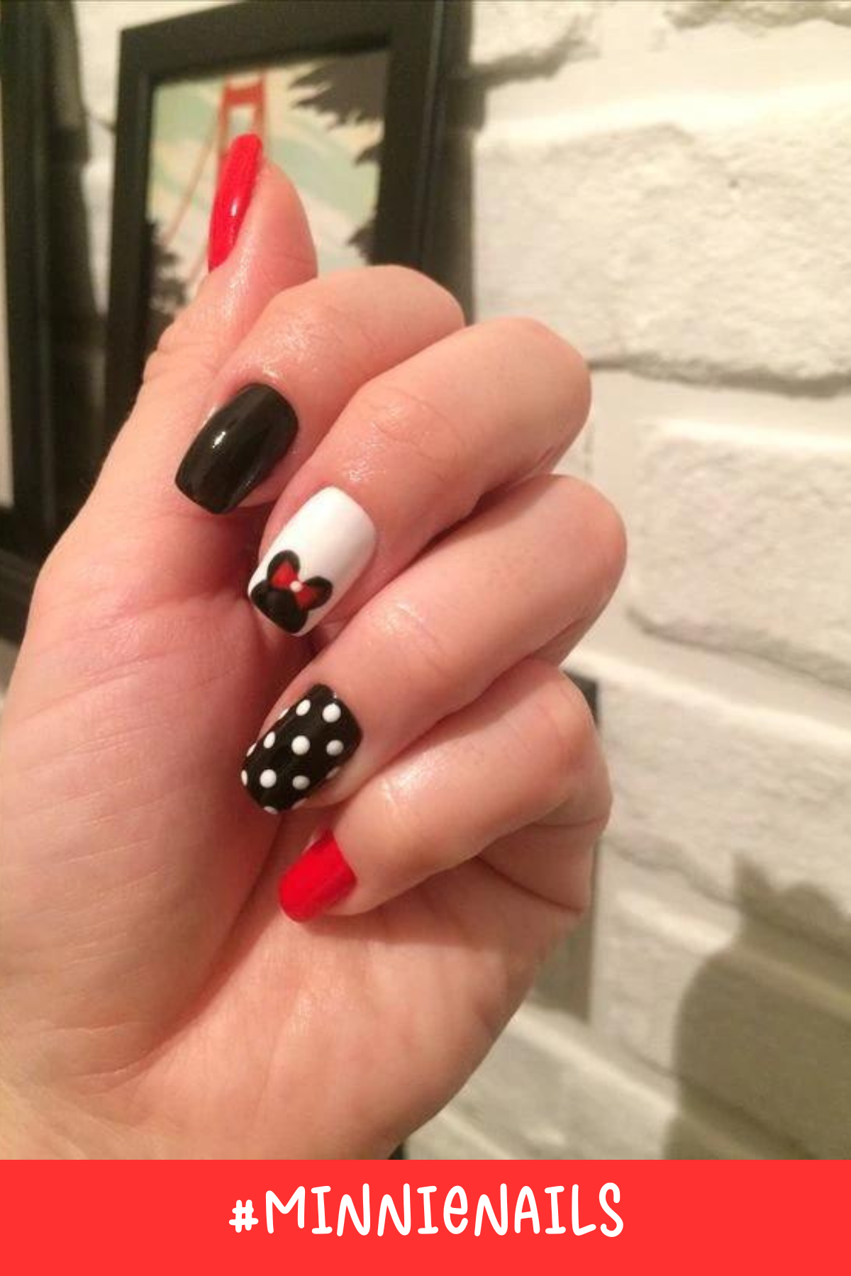 With a sleek combination of black, red, and white, these nails capture the essence of Minnie. The black polka-dot nail adds a playful contrast, while the red and white elements represent the classic Minnie Mouse colors.