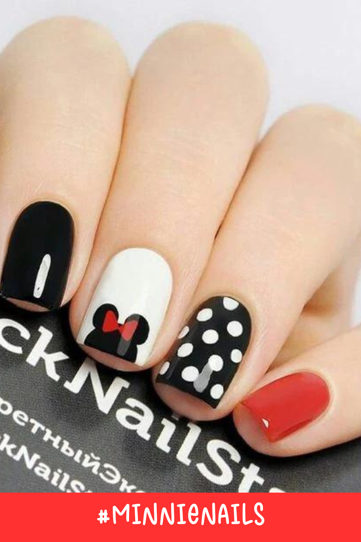 A classic Minnie look with a touch of sparkle! These nails feature red polka dots, a glittery silver accent, and a tiny Mickey silhouette on one nail for a simple yet stylish Disney-inspired manicure.