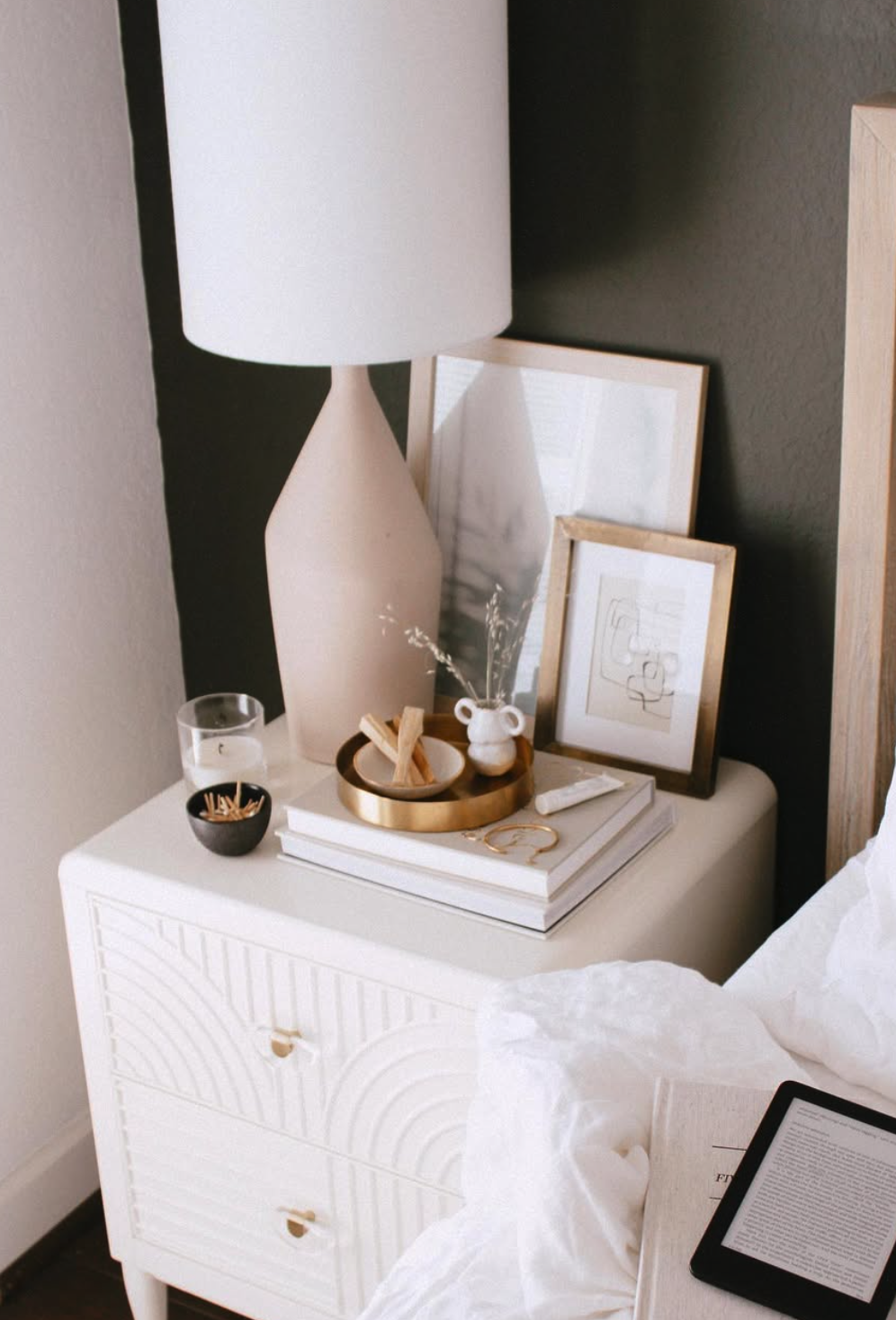 A clutter-free and stylish nightstand adds to the overall serenity of the bedroom. Replace clutter with just a few well-chosen items, such as a chic lamp, a small stack of books, or a decorative tray.