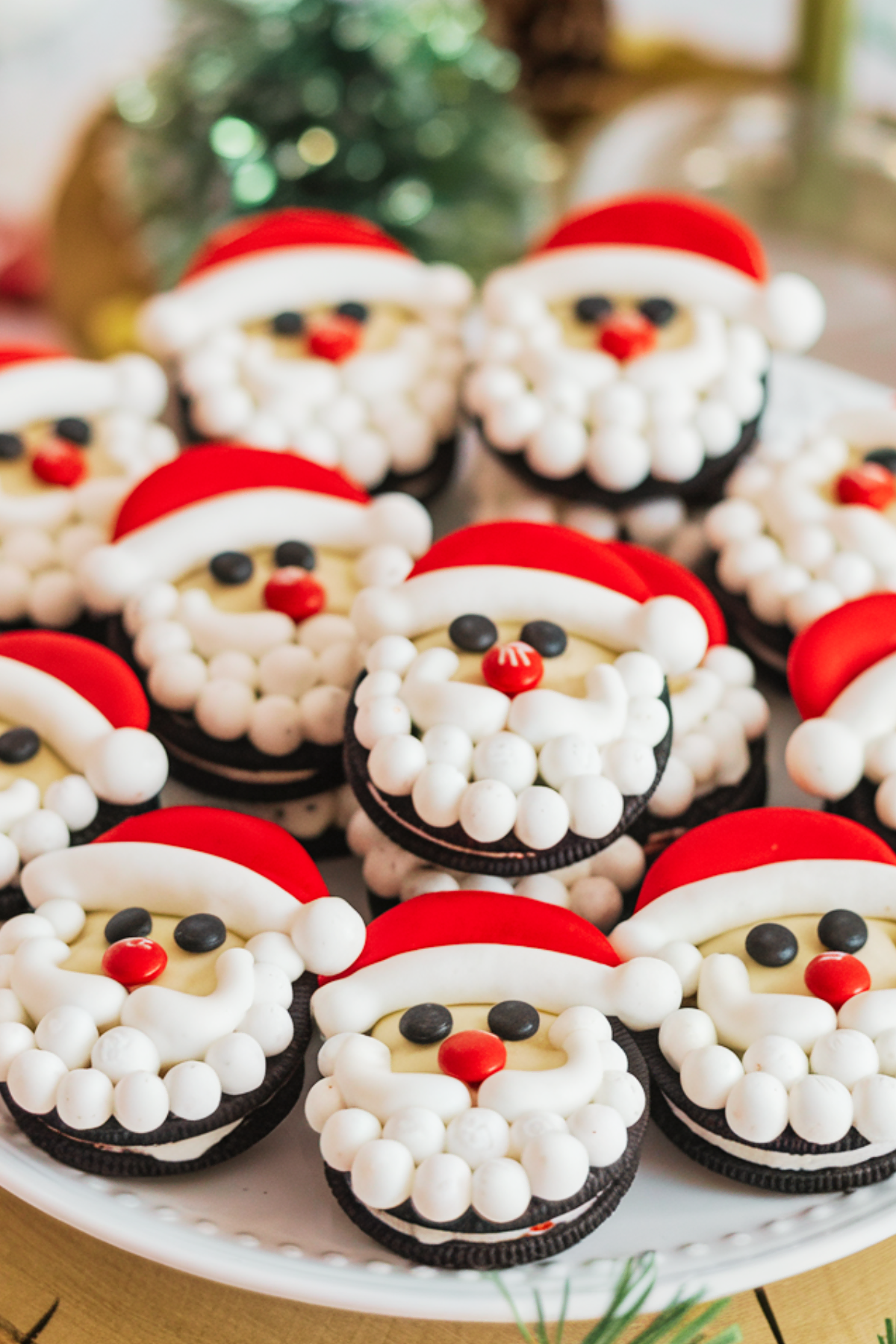 These cute Santa Oreo Cookies are a no-bake holiday hit! A simple and creative addition to your Christmas cookie recipes lineup. They are so easy to make the kids can have fun making them as well as eating them!