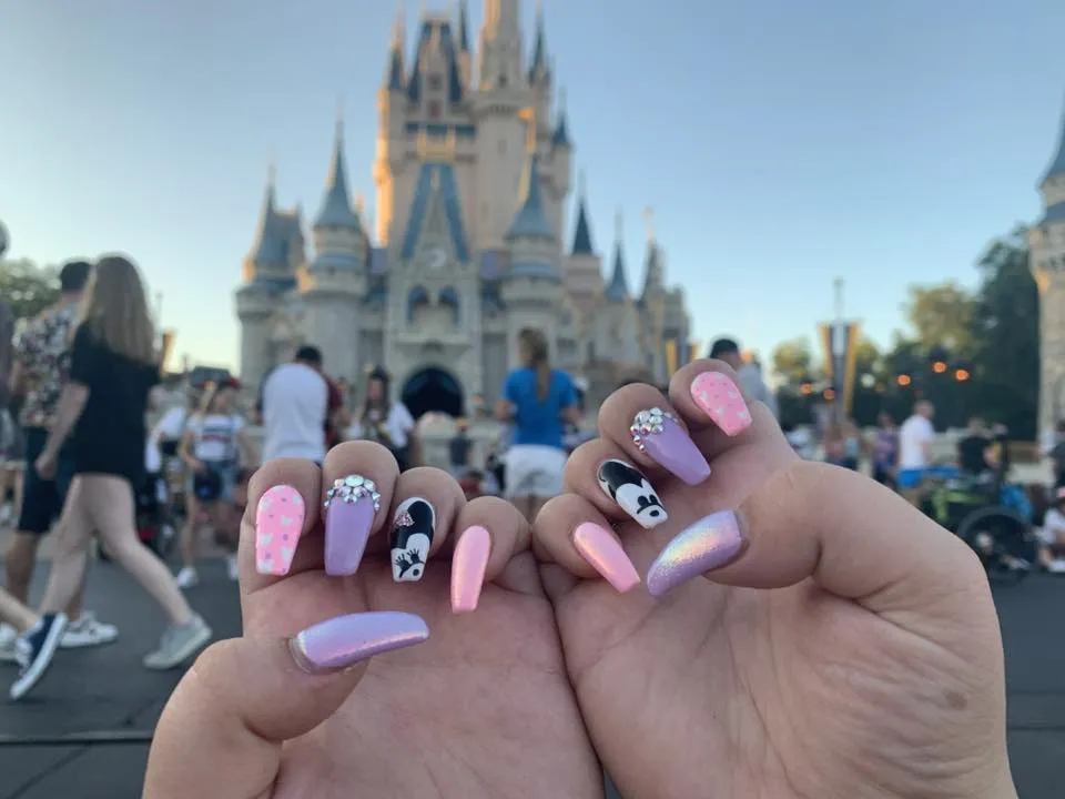 Pretty in pink with a hint of sparkle, these nails mix soft pastels and glimmering rhinestones with adorable Mickey and Minnie art. A must for a Disney trip or anyone who loves cute, feminine vibes.