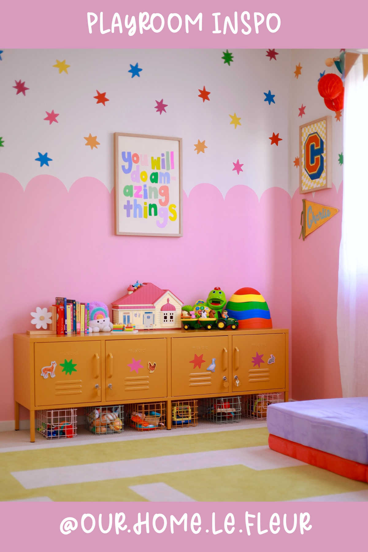 @our.home.le.fleur (Pink Room) - A playful mix of pinks and yellows, this room is all about fun! The scalloped wall paint adds a whimsical touch, and the rainbow toys keep things vibrant and exciting. With lockers for storage, this room is both functional and brimming with personality!