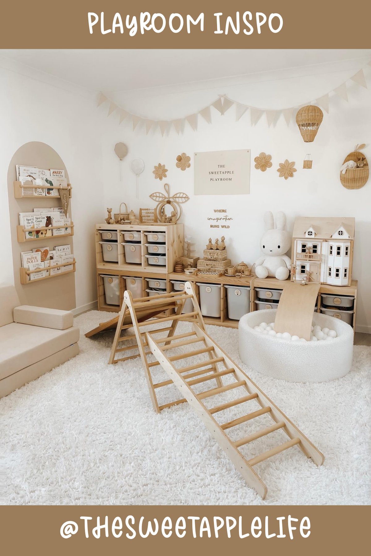 @thesweetapplelife - This playroom is all about natural tones and calming vibes! With its wooden shelves and neutral-colored bins, it's both stylish and functional. That adorable ball pit and mini climbing set add a fun, active play element, making this space perfect for little explorers!