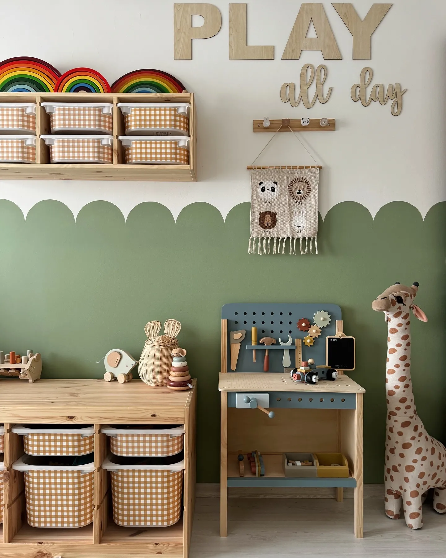 Nature-Inspired Playroom – Soft greens, wooden accents, and rainbow decor give this play space a warm and inviting feel with an emphasis on open-ended play.