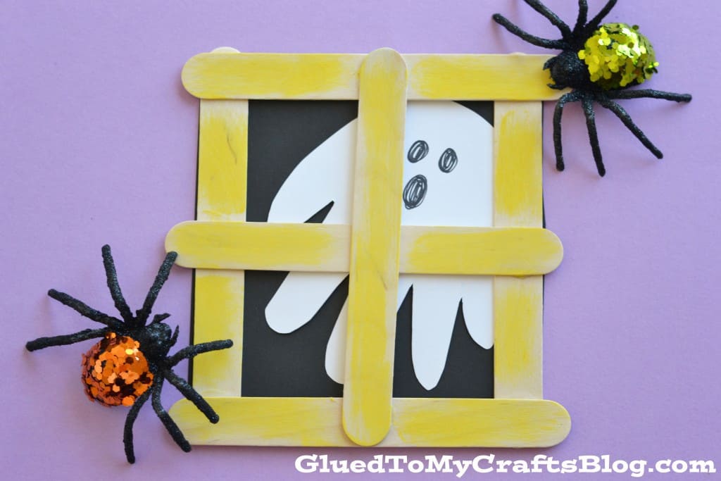 Popsicle stick craft meets handprint craft... what a fabulous idea! Love that little ghost peeking through the window.